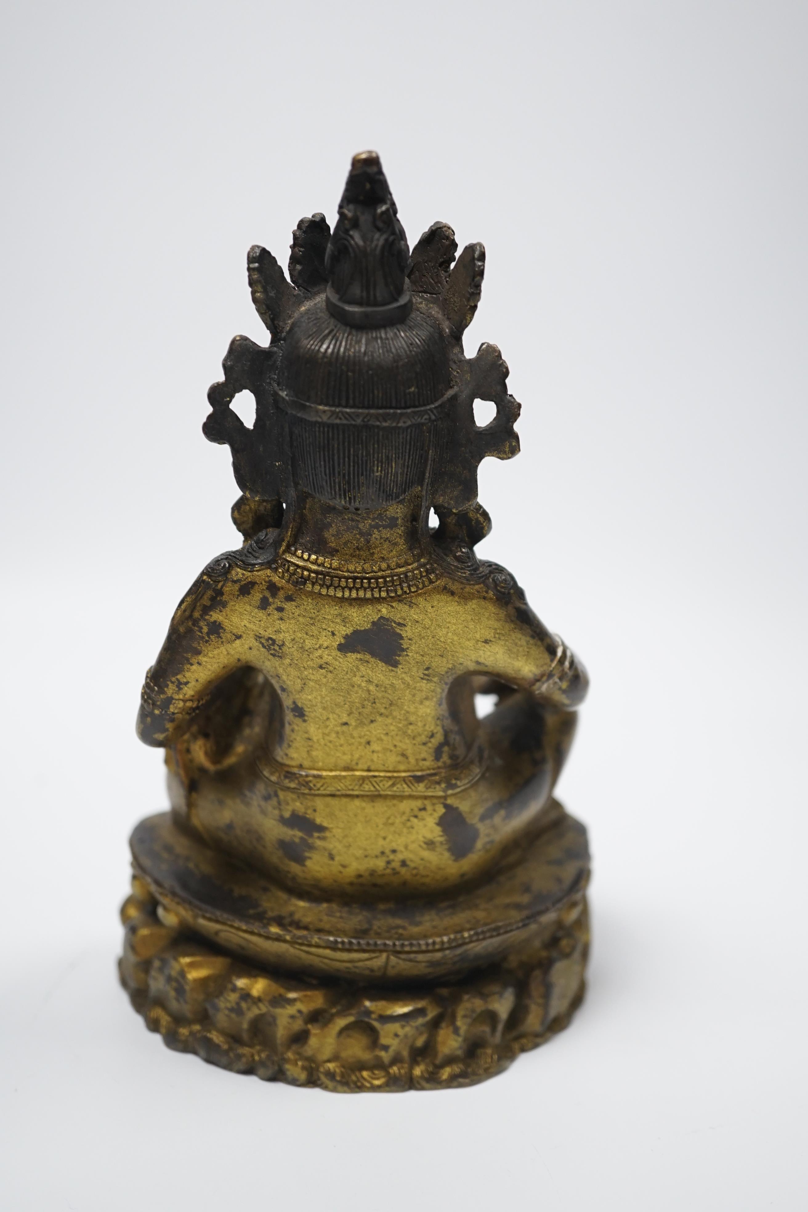A Sino-Tibetan figure of Jambhala, 18.5cm high